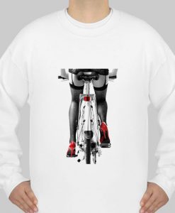 Sexy woman in red high heel shoes and stockings riding bicycle sweatshirt